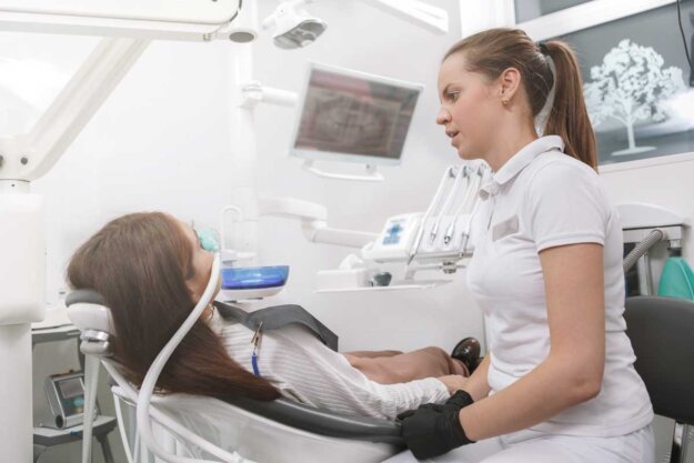 Can Sedation Dentistry Help With My Dental Anxiety a dentist sedates a patient before a procedure