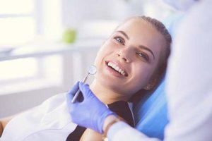 female patient receiving a fluoride treatment