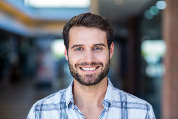 man smiling after having mouth cancer screening test