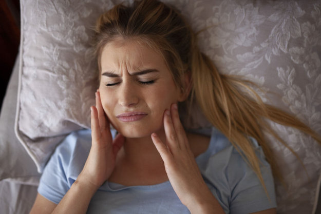 woman in discomfort unaware of tmj