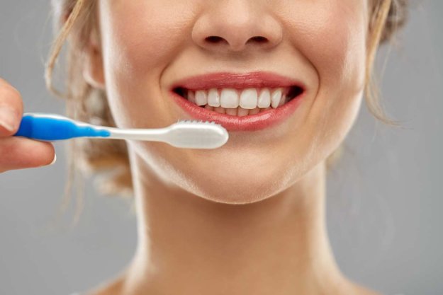 dental care, oral health Woman Showcasing Her Dental Implants