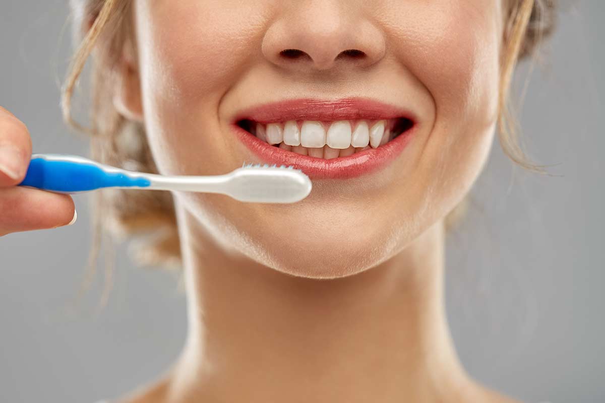 Woman Showcasing Her Dental Implants