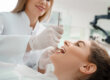 a dentist expert works on a patients mouth after patient asked how to find a good cosmetic dentist
